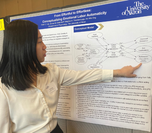 Women presenting research.